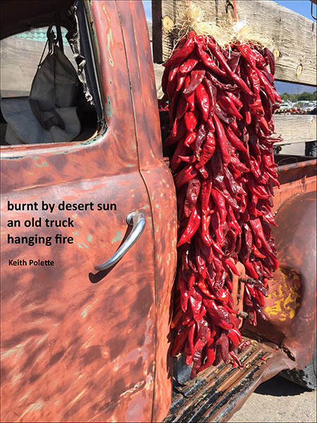 'burnt by desert sun / an old truck / hanging fire' by Keith Polette