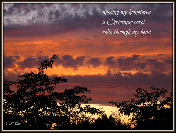 "missing my hometown... / a Christmas carol / rolls through my head' by Christine Villa