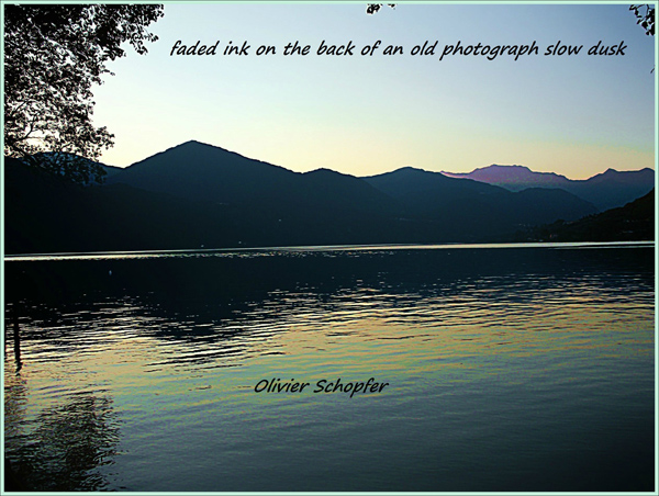 'faded ink on the back of an old photograph slow dusk' by Olivier Schopfer