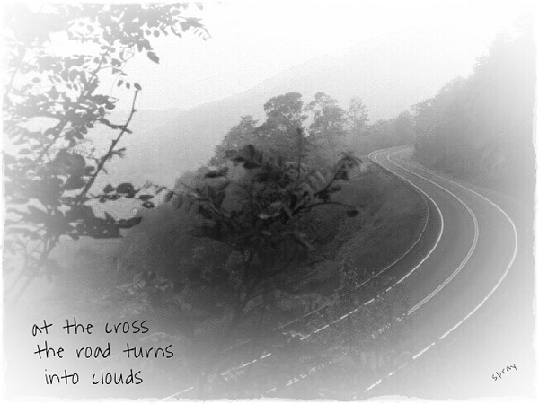 'at the cross / the road turns / into clouds' by Sandy Pray