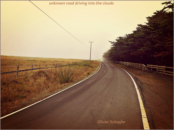 'unknown road driving into the clouds' by Olivier Schopfer